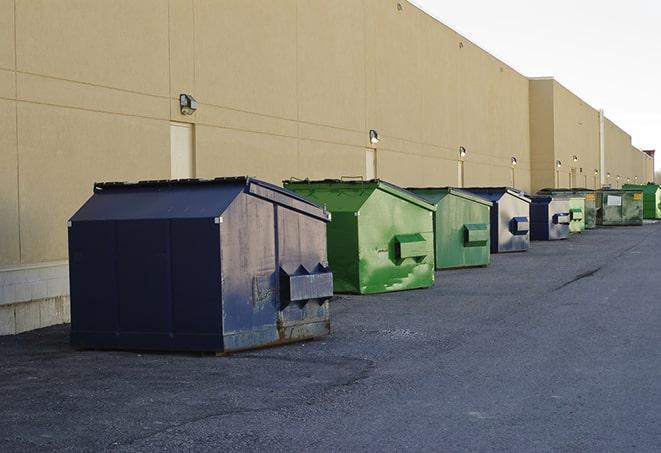 brightly colored dumpsters filled with construction waste in Cranford